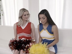 Cheerleaders Amber Moore And Nina Nieves Stretch Each Other